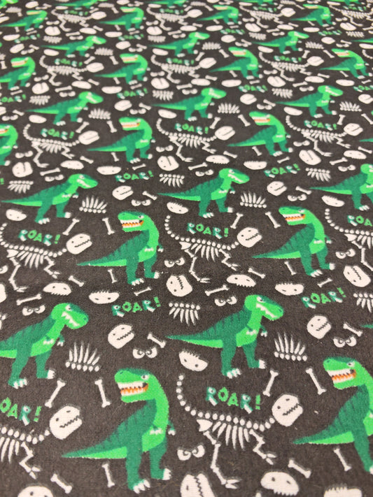 DINO BONES – BLACK & GREEN POLYCOTTON WINCEYETTE – 80% COTTON / 20% POLYESTER – 108cm WIDE