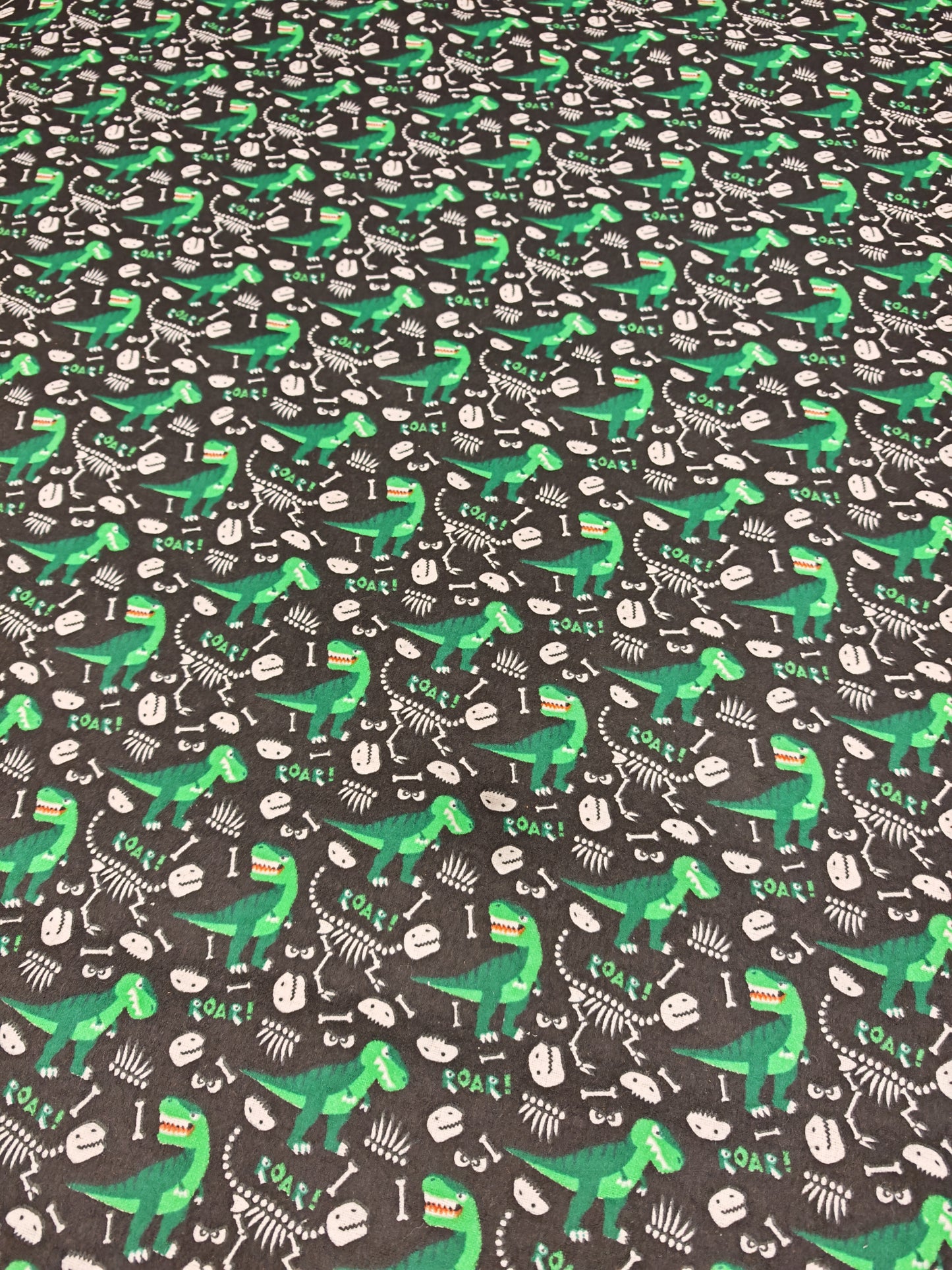 DINO BONES – BLACK & GREEN POLYCOTTON WINCEYETTE – 80% COTTON / 20% POLYESTER – 108cm WIDE