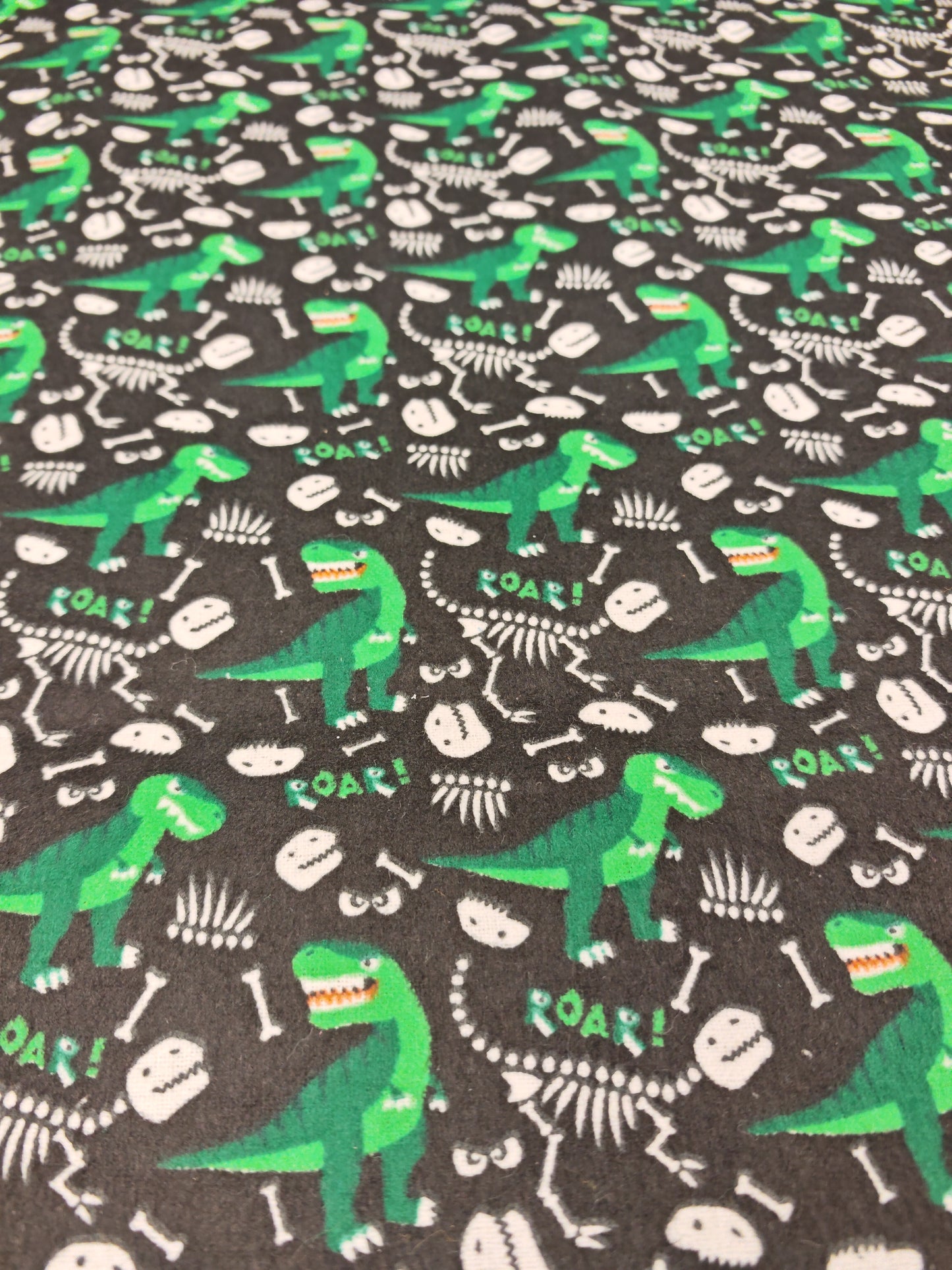 DINO BONES – BLACK & GREEN POLYCOTTON WINCEYETTE – 80% COTTON / 20% POLYESTER – 108cm WIDE